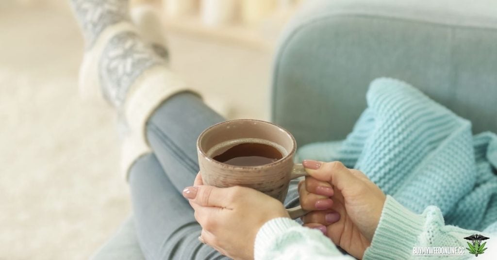 being relaxed with a hot mug on their hands